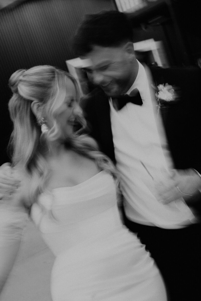 Bride and groom walk down the street after their wedding at The Shack Revolution.