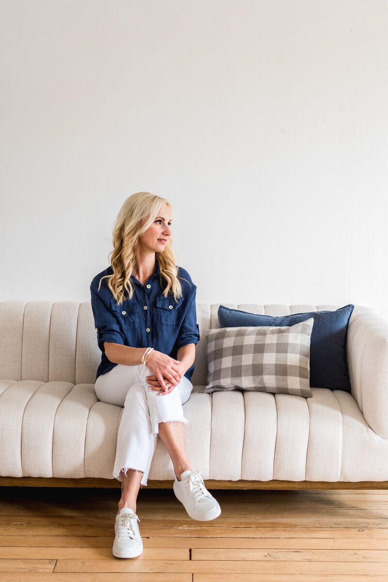 woman sitting on couch looking away