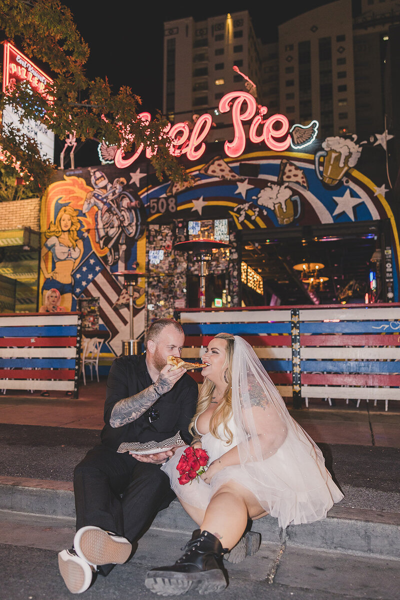 bride and groom in classic red car after elopement in las vegas
