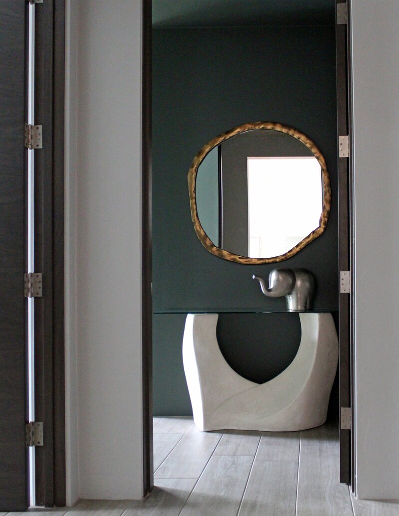 Music room entry with Post Modern plaster console and sculpted mirror
