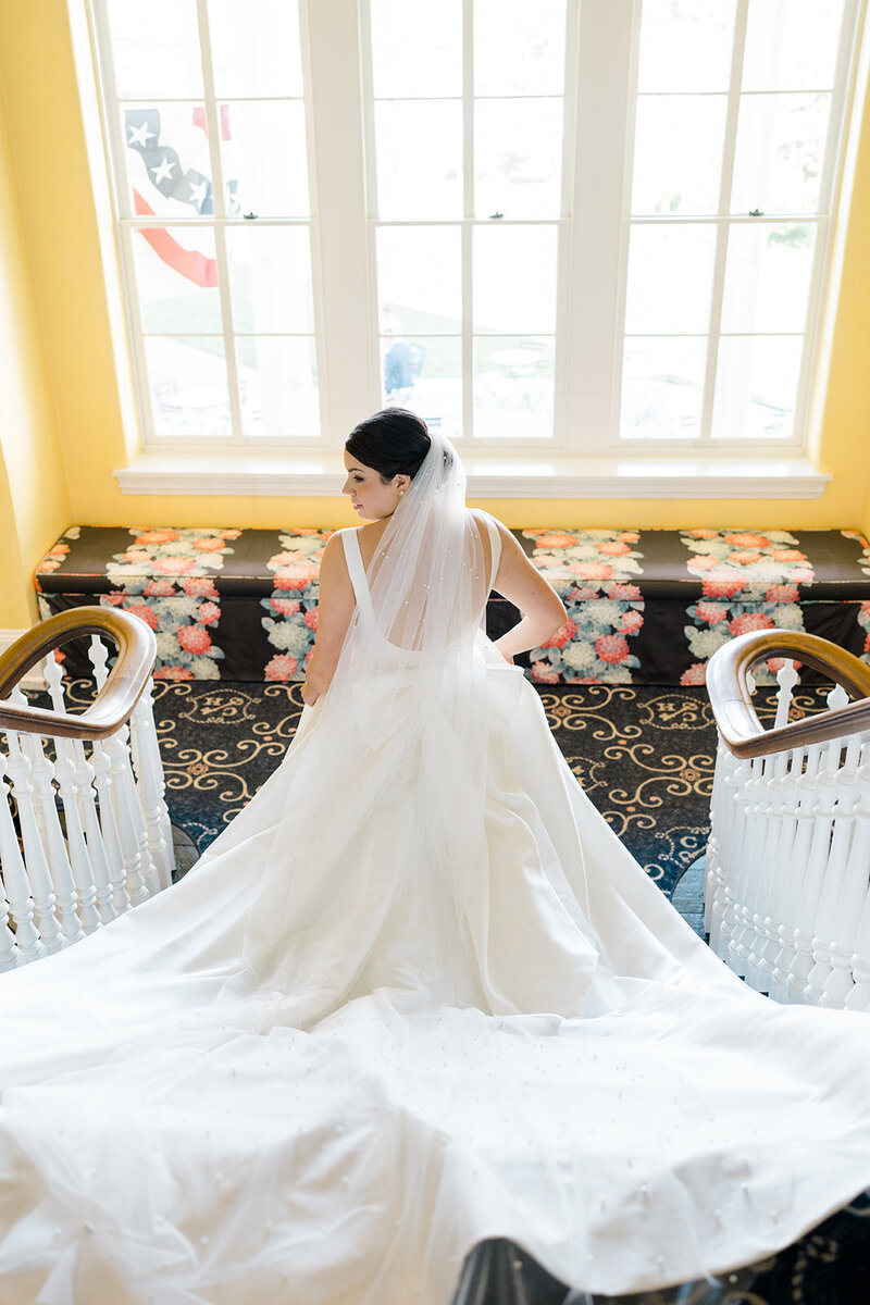 Bride walking down the stairs at Congress Hall Hotel in Cape May, NJ
