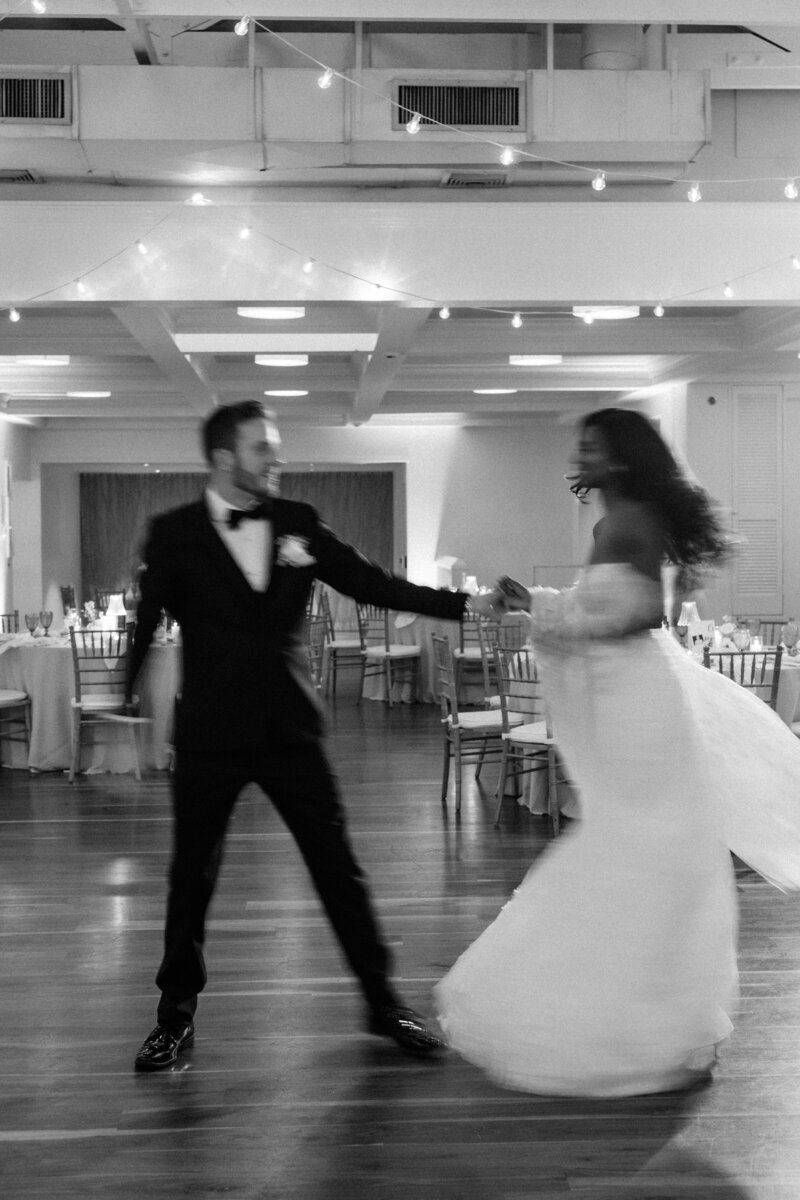 Blurry photo of bride and groom running inside at the end of the night at Glen Foerd Estate in Philadelphia, PA