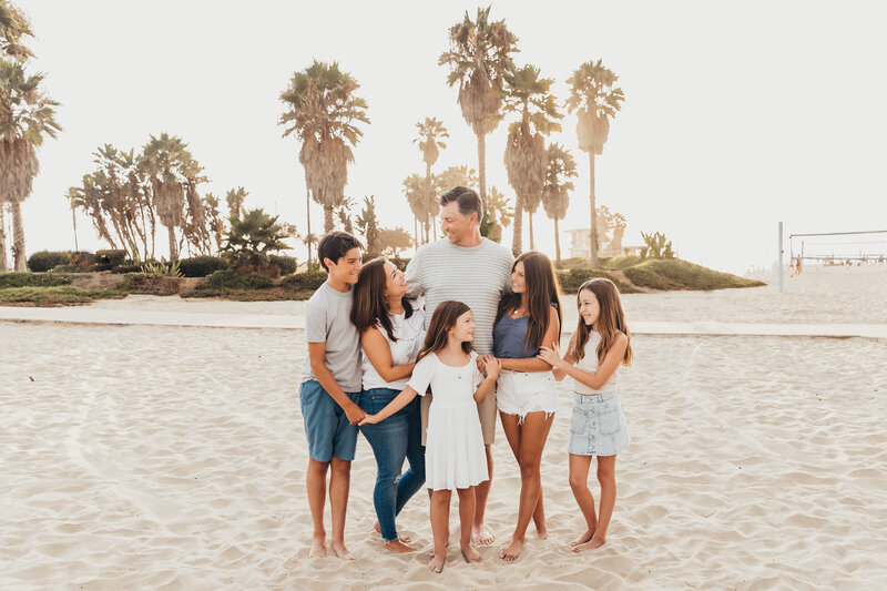 A family has fun together at Mission Beach in San Diego, CA