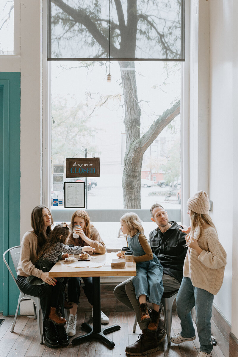 A family sits at a table in Lafayette, Indiana's Sweet Revolution pastry shop. 