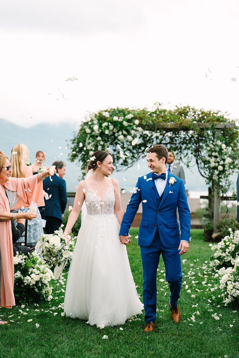 New England couple smiling at each other at their wedding