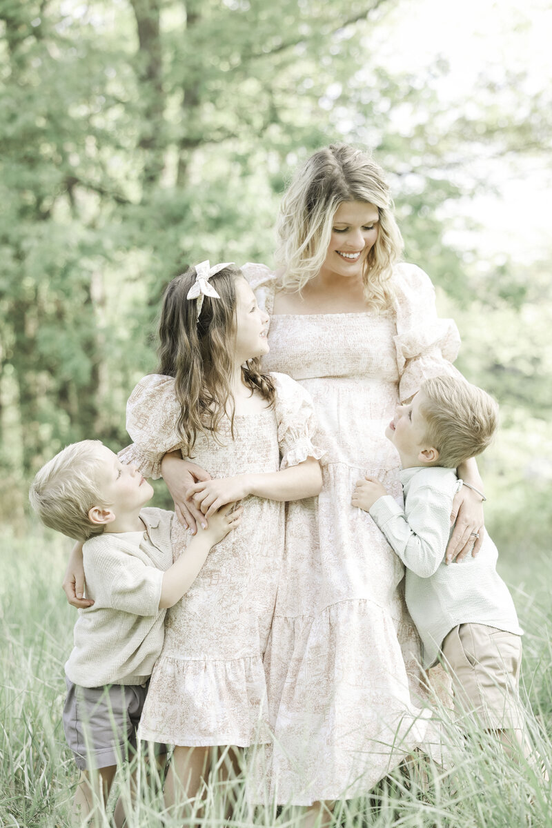 Beautiful mama with her daughter and two sos, outdoor family photo session Asheville