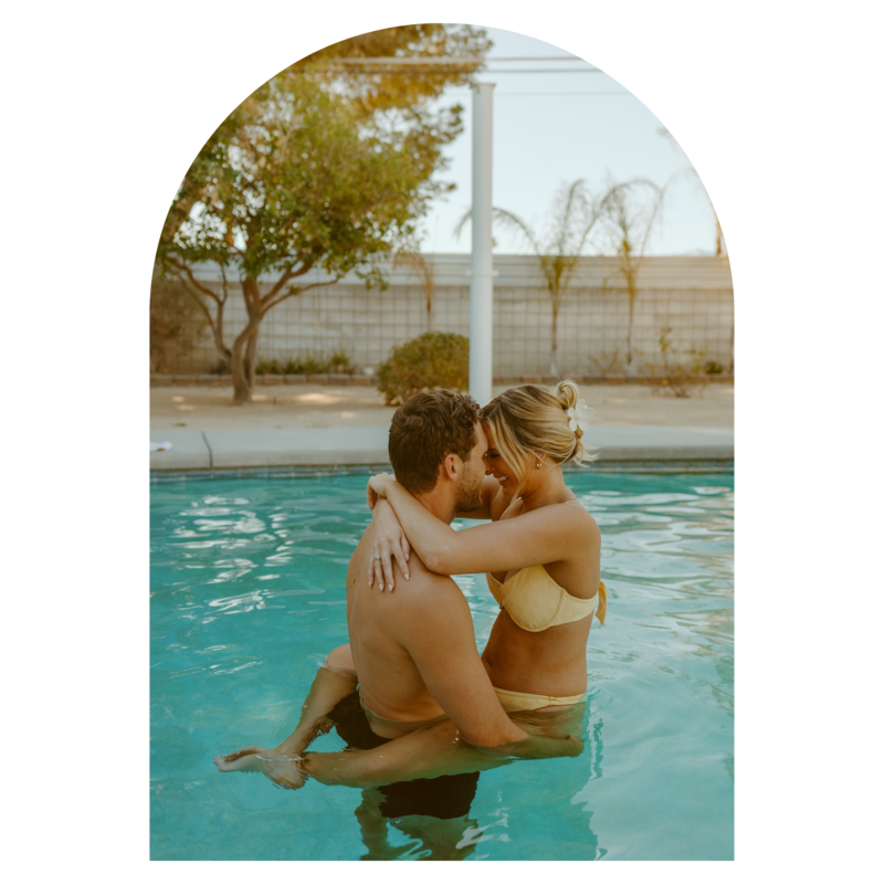 A Sweet Couple Standing on the Poolside Holding Each Others Hand while  Smiling at the Camera · Free Stock Photo