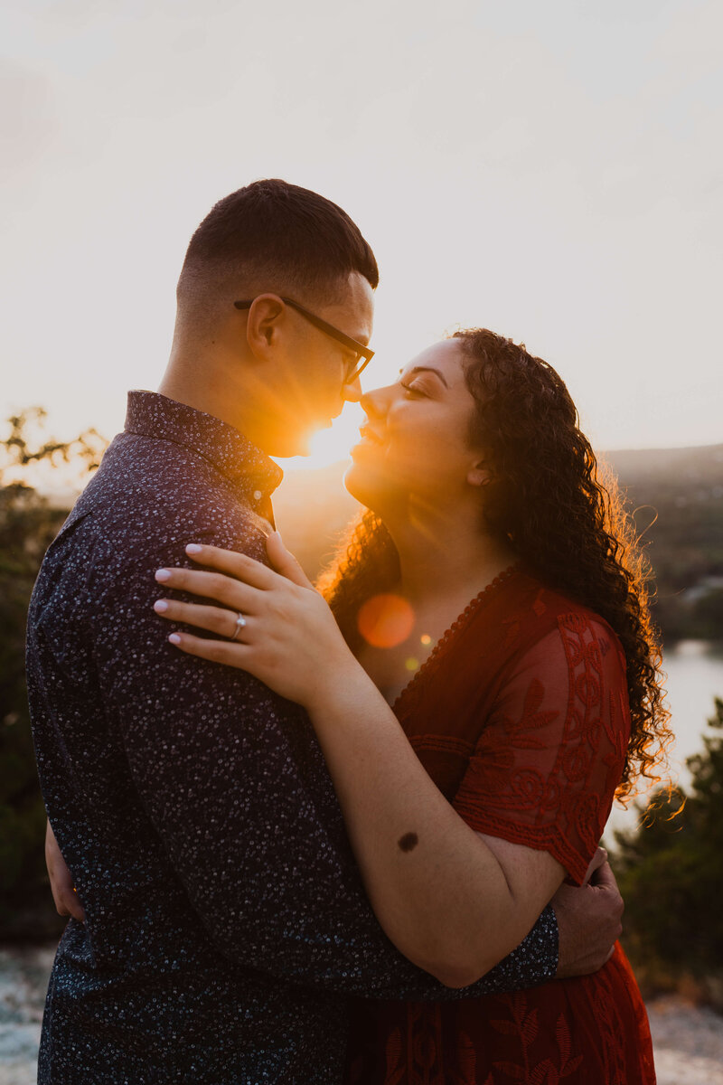 Sun Flare During a Tender Couples Engagement Session by TLC Photography
