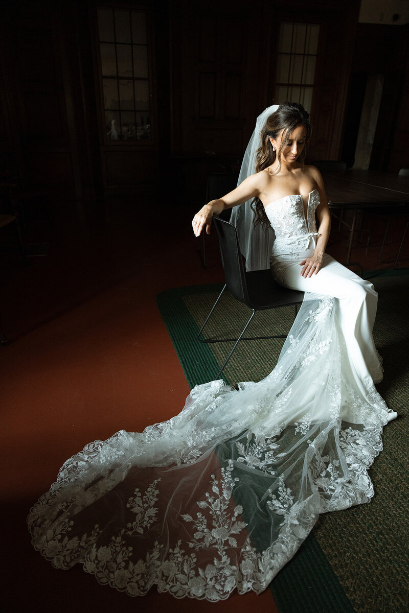 Bride caught in dramatic light while waiting her ceremony on the terrace at Cheekwood Gardens in Nashville, TN.