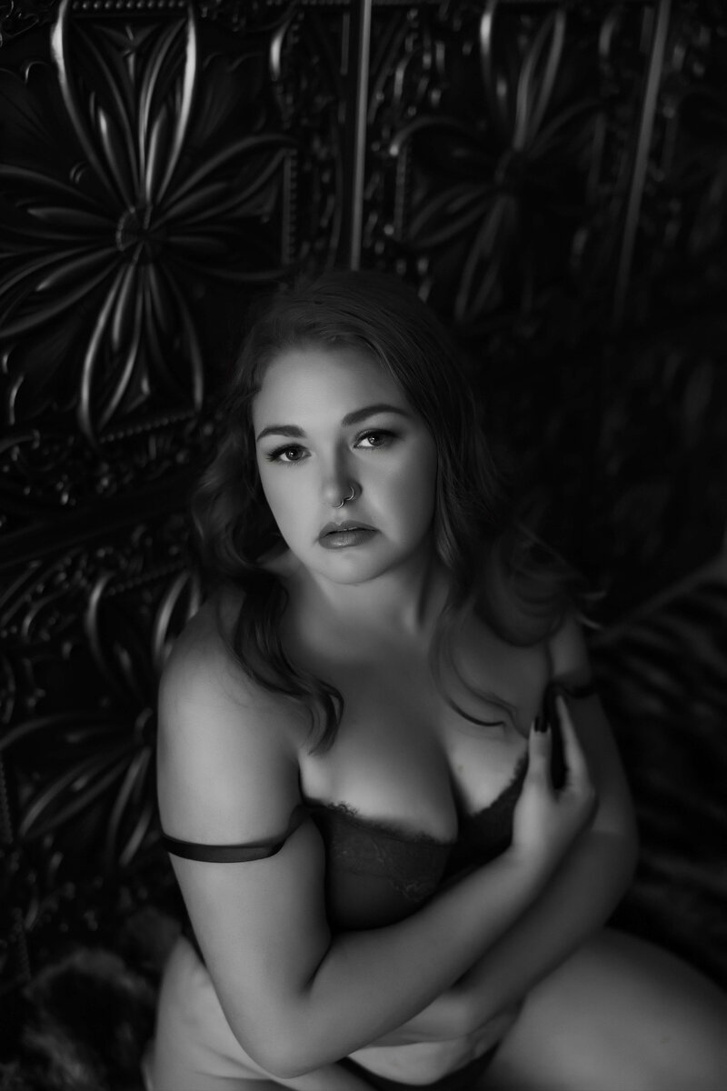 woman posing on floor in lingerie