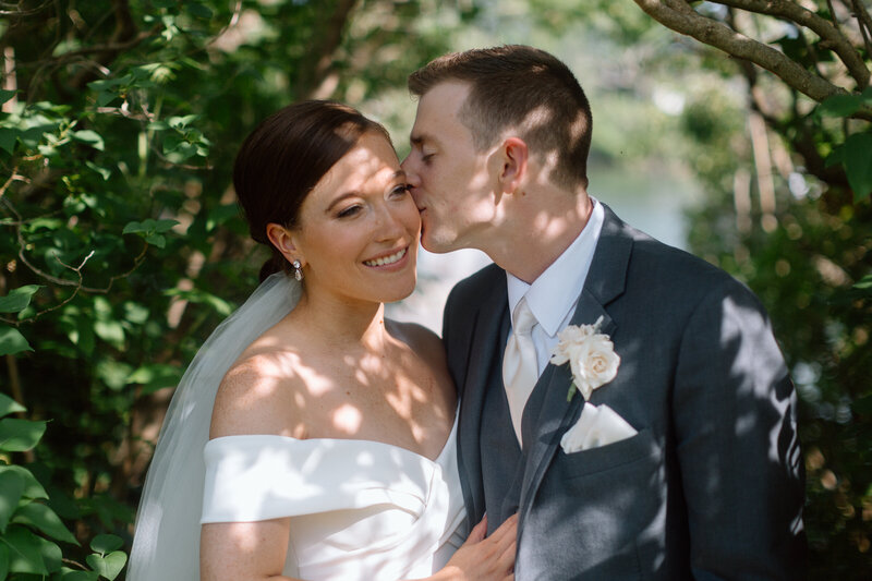 bride-groom-cuddle-kissing