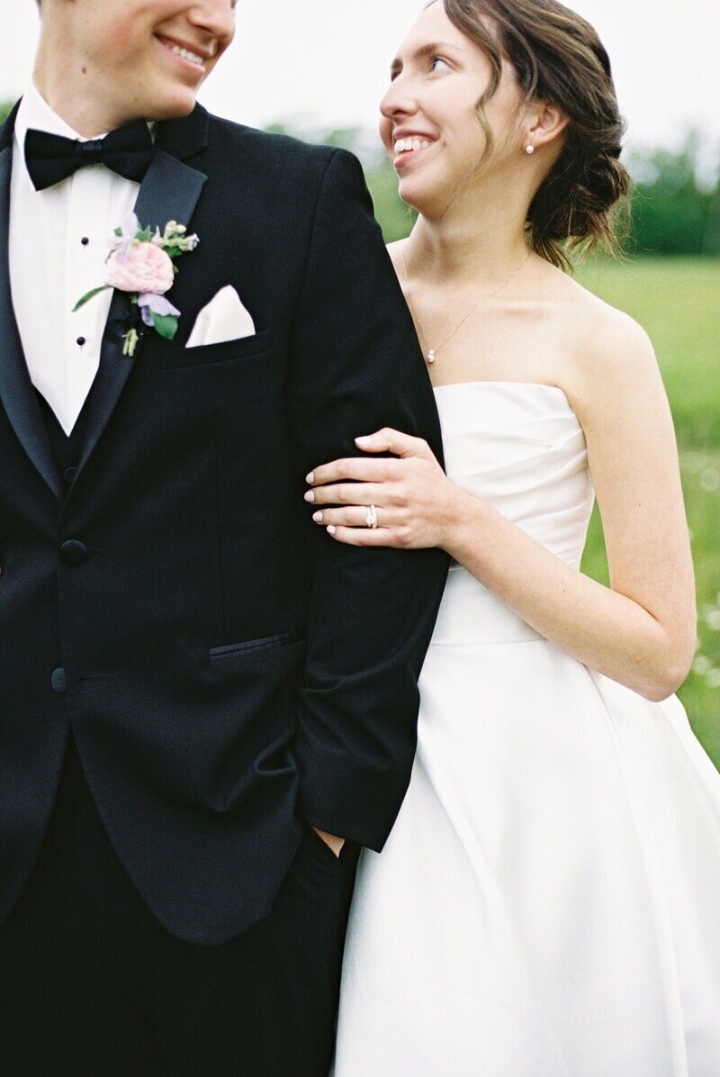 Bride and groom posing together just after their wedding ceremony, captured by Milwaukee wedding photographer Emily Barbara in a romantic portrait.