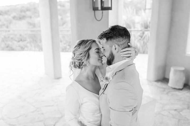 Black and white photo of a bride and a groom  eloping at Chapel Dulcinea photographed by Austin  TX Wedding Photographer Lydia Teague