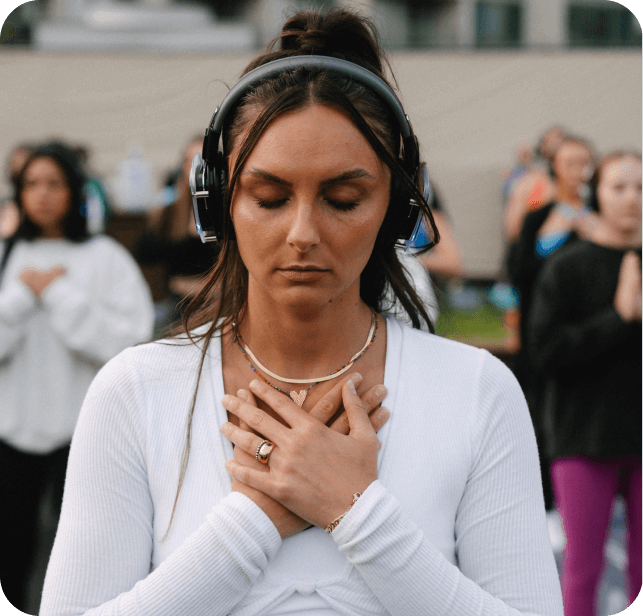 Girl with hand over heart during a standing meditation