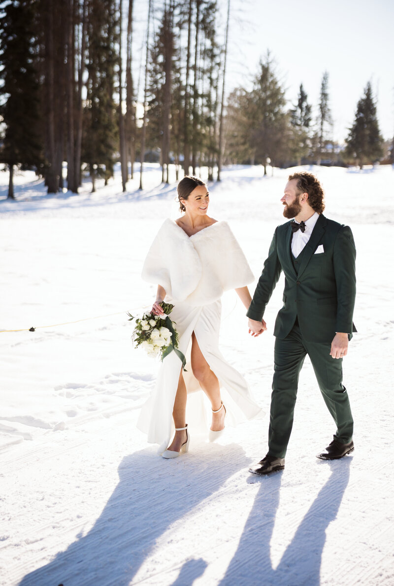 Montana wedding couple walking in snow