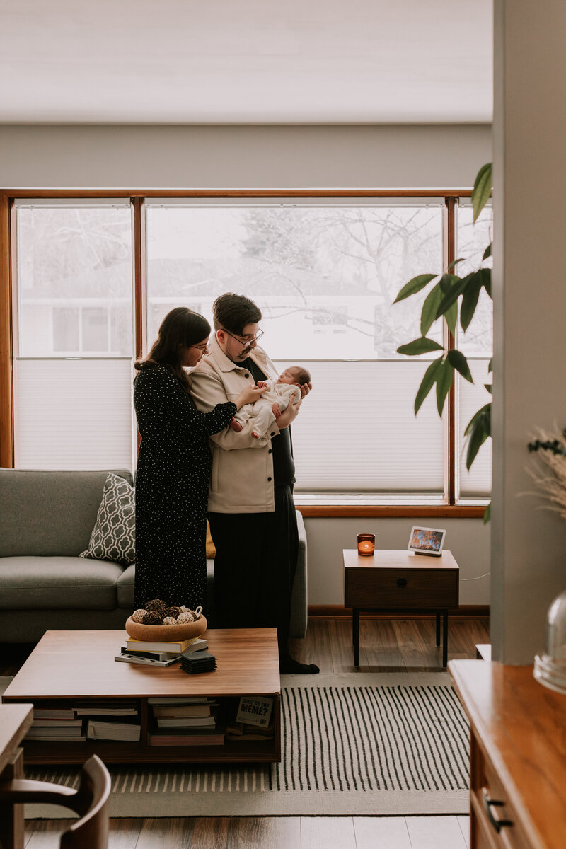 parents at home with their newborn baby girl in Winnipeg 