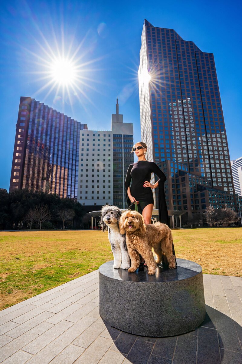 fashion portrait of woman with two doodles in downtown Dallas