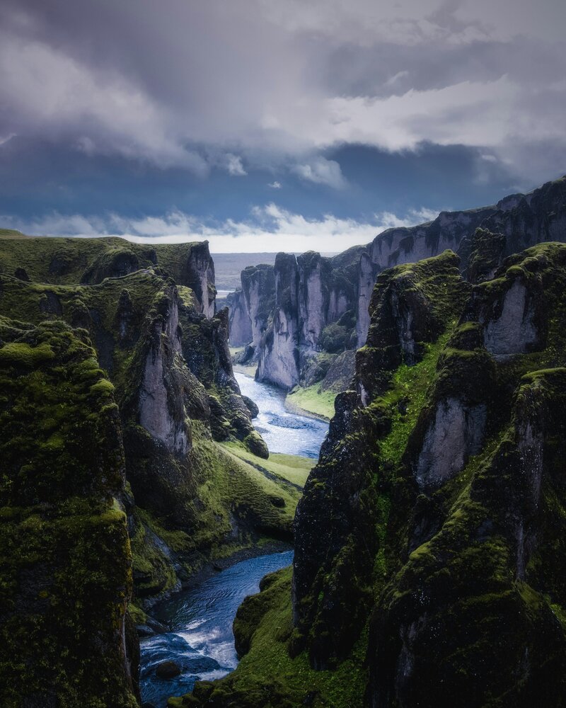 river flowing through cliffs