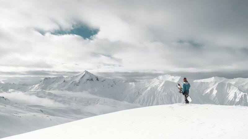 Man looking at mountains in Japan, Hakkuba - Ski / Snowboarding retreat - Santai Retreats 