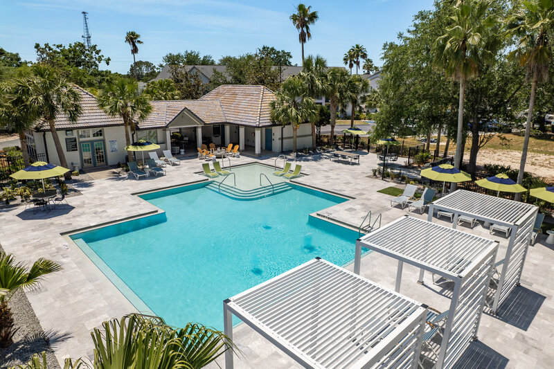 commercial design by Gracious Home Interiors of an outdoor pool deck 