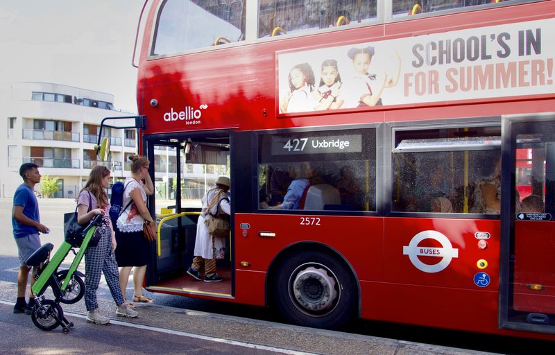 College student waiting for the bus in London