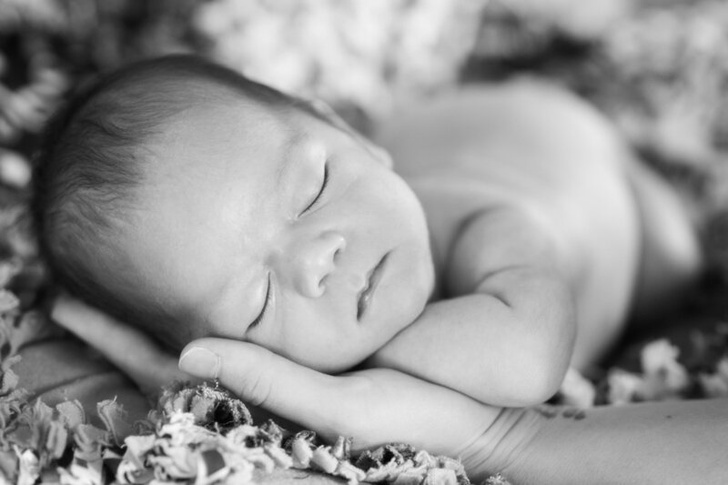 Newborn Photography baby in moms hand. Photographer in Wichita Falls Texas