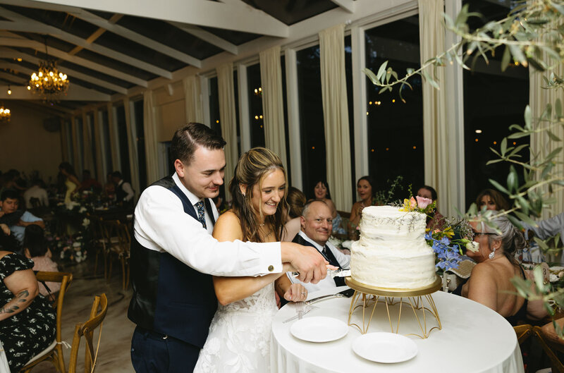 Bride and groom cutting their cake