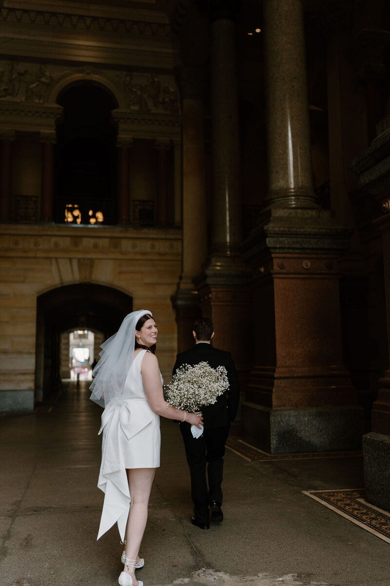 Bride and Groom walking to their city hall elopement in Philadelphia
