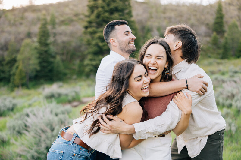 Family laughing and hugging each other during their Family Session in Memphis, Tennessee.