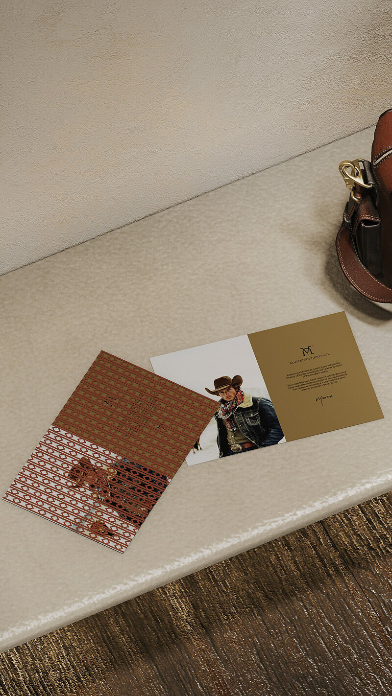 Marone brand materials featuring cowboy-inspired welcome card and patterned insert, emphasizing timeless design and Western identity.