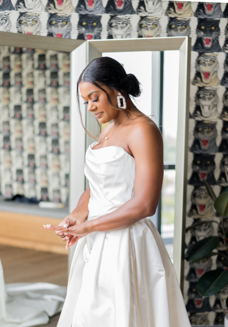 Bride admiring her engagement ring before her wedding