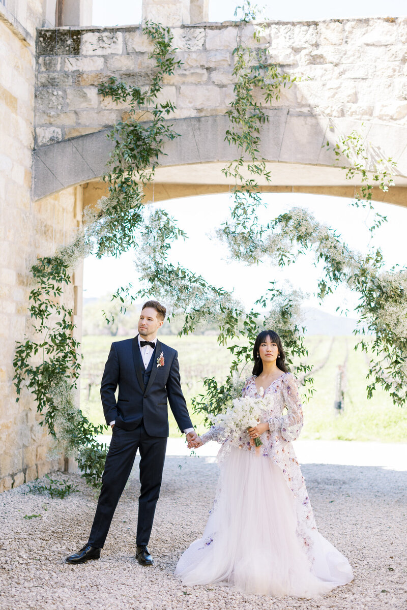 Wedding and Elopement Photographer, woman fanning herself in robe standing in a doorway