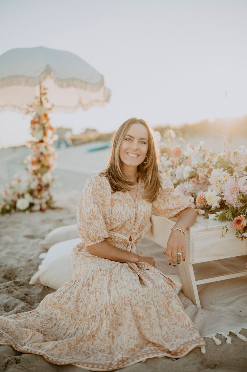 A woman sits for a picture.