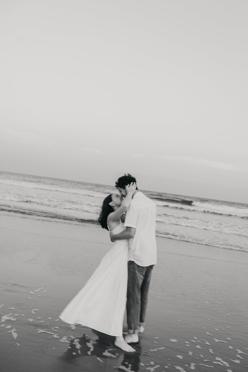 couple embrace on the beach in NJ