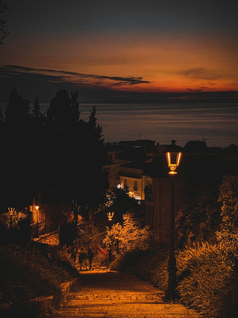Lantern Path near sunset coast w people