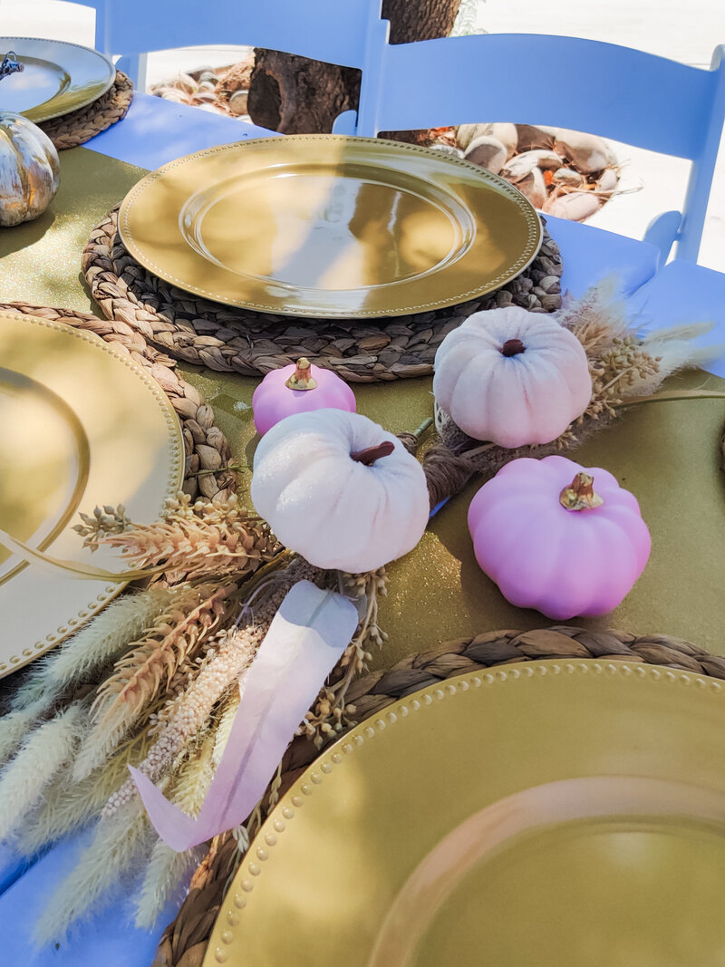 Elegant boho-inspired wedding ceremony backdrop with gold arches, macramé panels, and white floral arrangements styled by Stars and Stripes Events in Arizona.