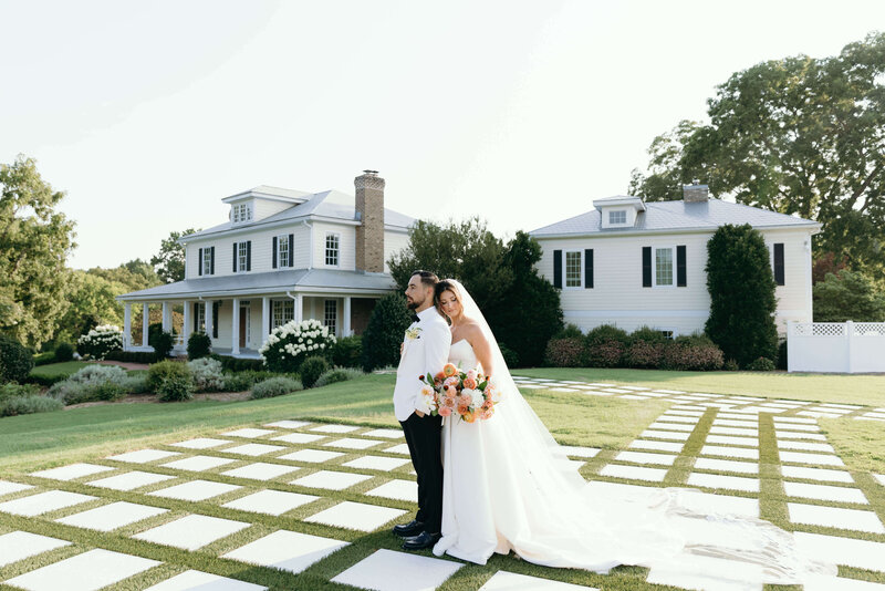 The happy couple poses at a charming outdoor wedding venue, creating beautiful memories for a lifetime