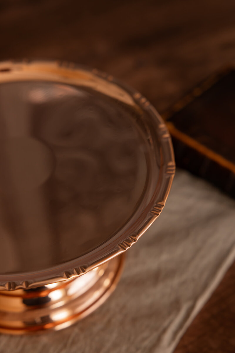 coppermill kitchen cakestand top view on cloth on wood table 