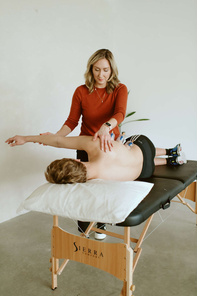 Dr. Gwen providing shoulder rehabiliation