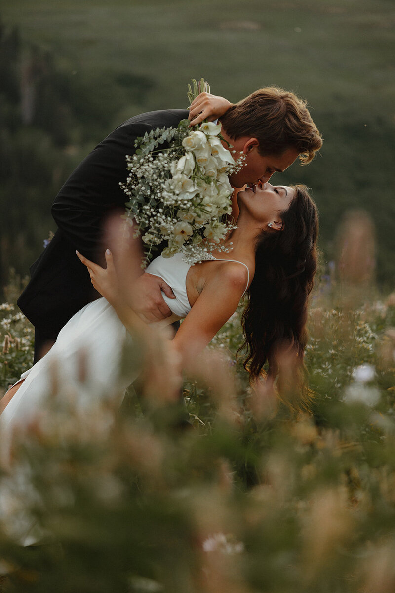 A destination elopement with the couple in a field during their elopement photos
