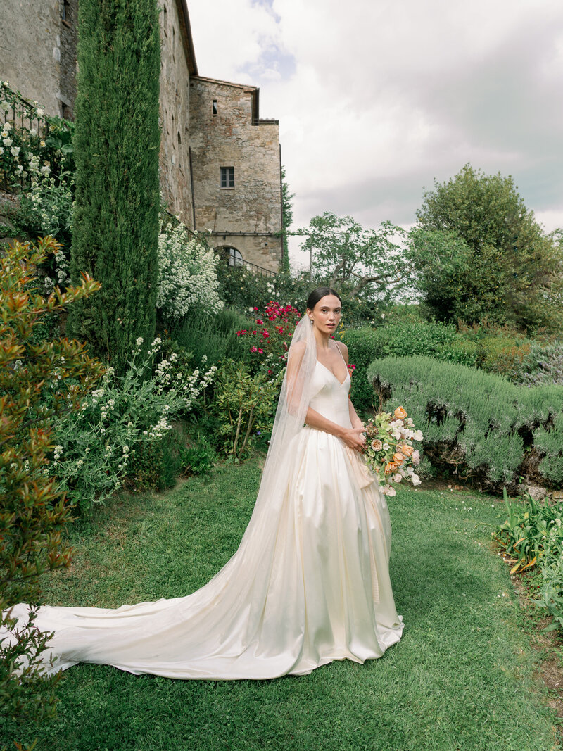 Bride in Danielle Frankel and groom during wedding ceremony at Filoli Gardens