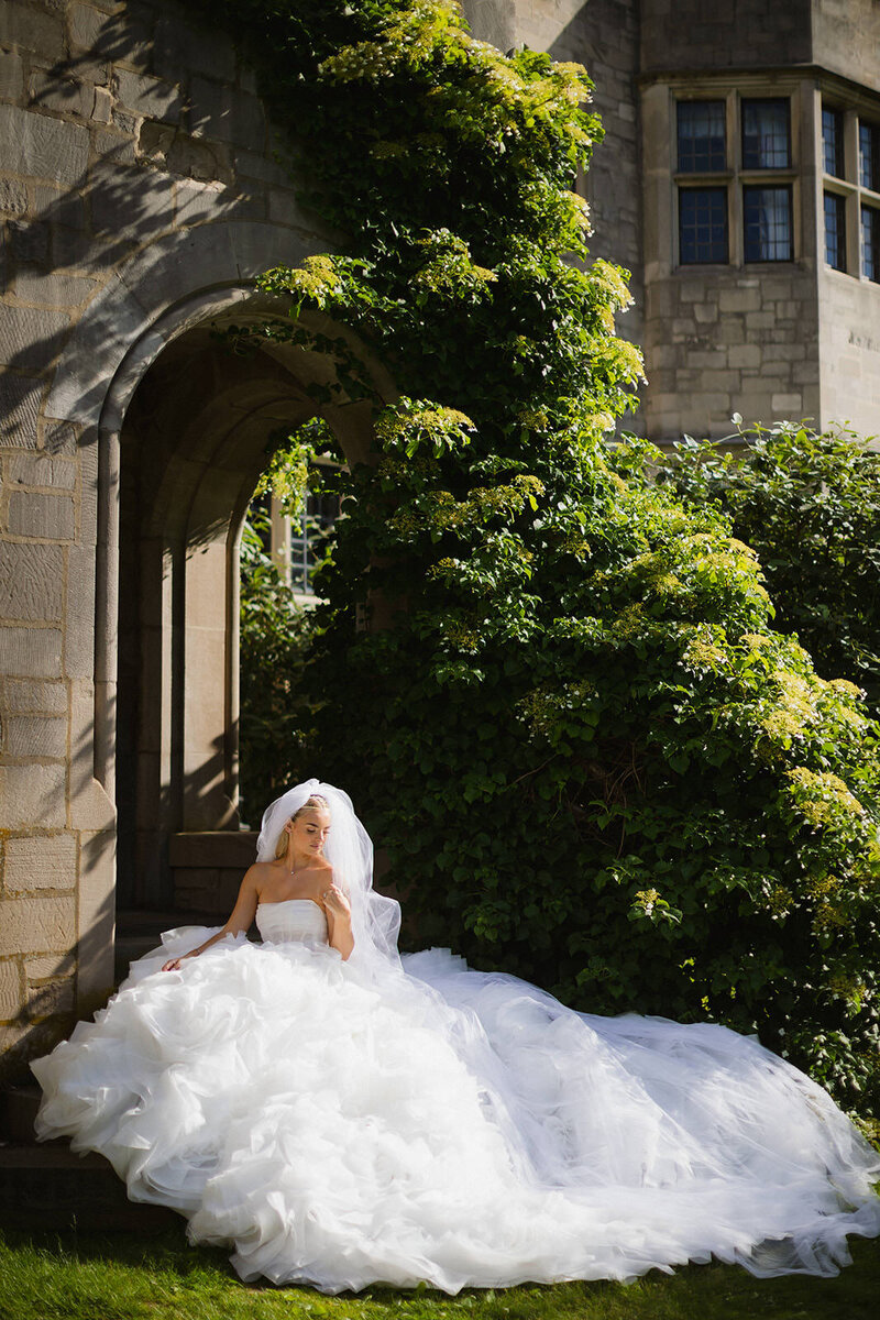 bride sitting in luxury tulle wedding gown