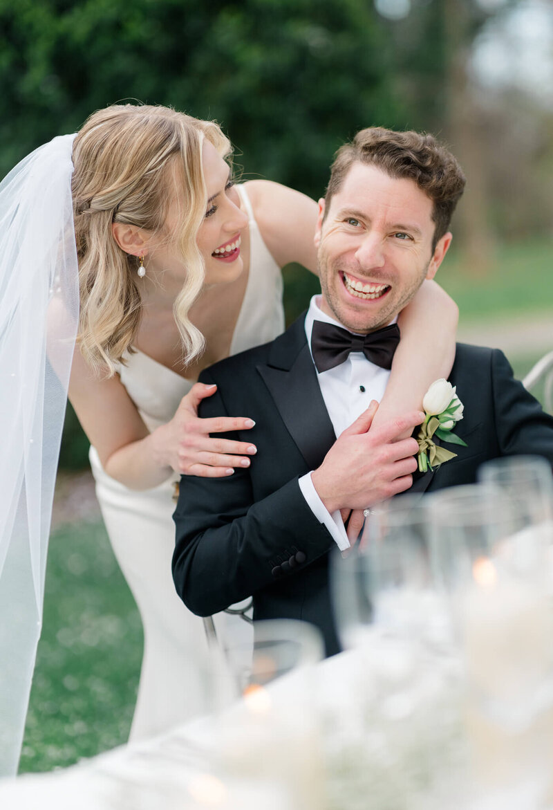 Bride and Groom laughing during speeches at The Market at Grelen. Captured by Charlottesville Wedding Photographer Bethany Aubre Photography.
