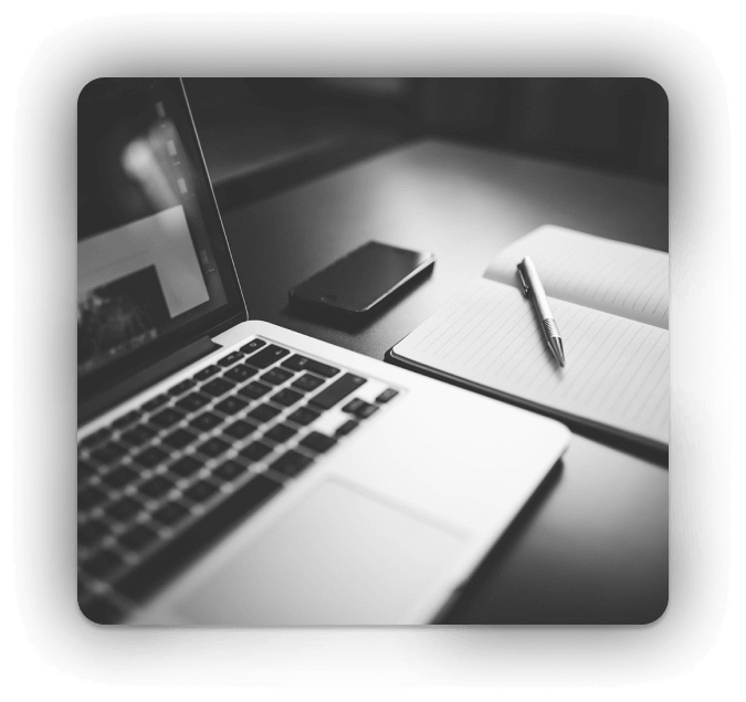 laptop phone and a notepad