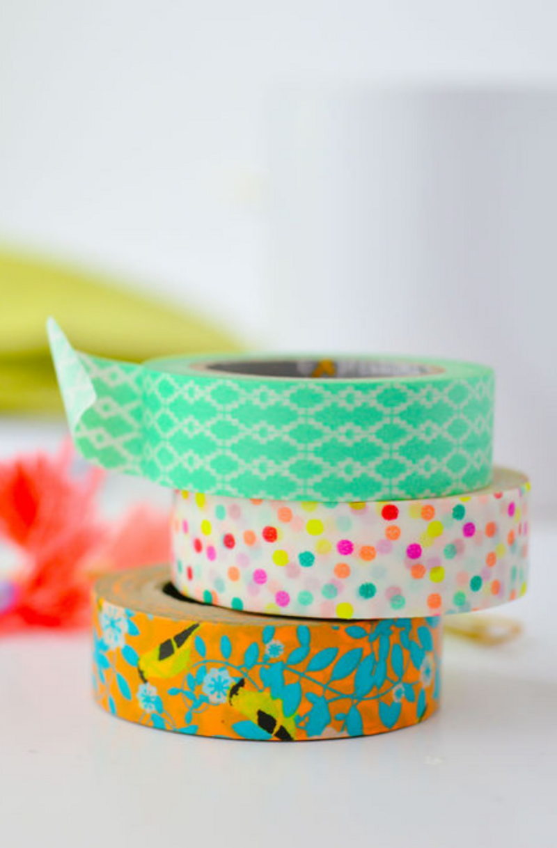 A stack of brightly colored washi tape
