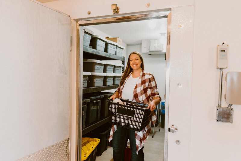 Cleaning and restocking the meat freezer.