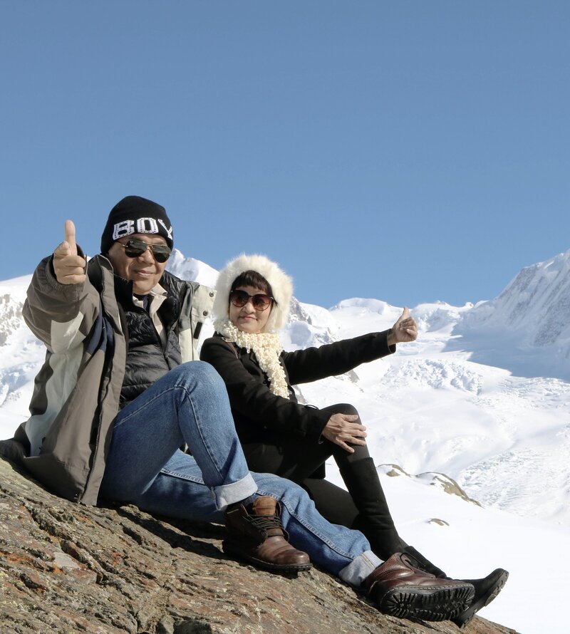 Asian Couple in MOuntains in Switzerland