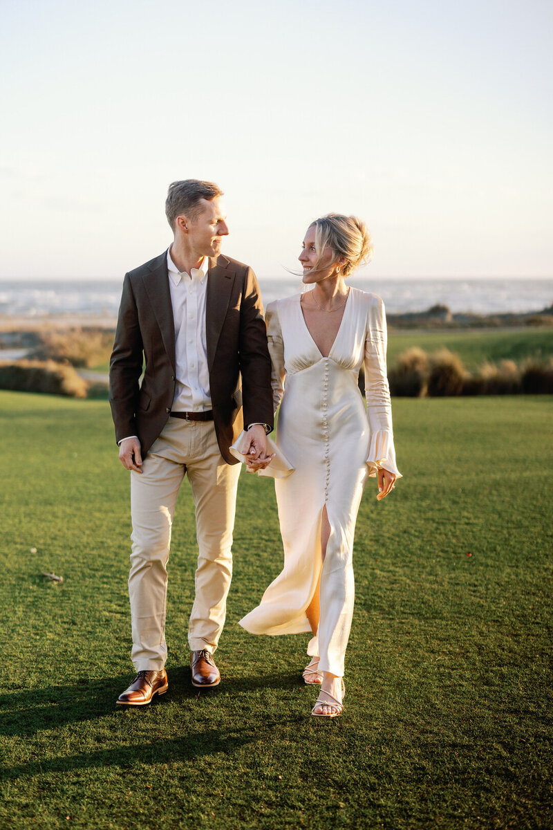 Bride and Groom kissing in field