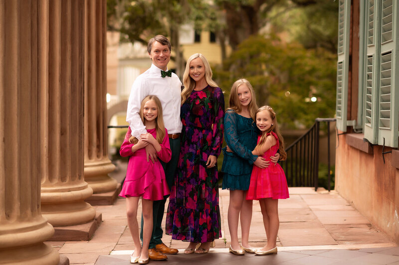 Family poses for holiday photos in Charleston.