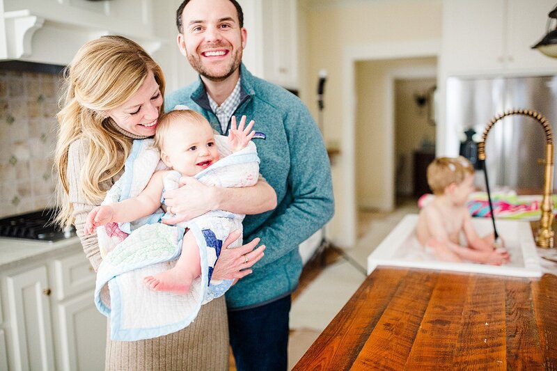 parents holding daughter by knoxville wedding photographer, amanda may photos